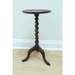 A 1920s twist-turned oak tripod wine table, 30 cm x 58 cm