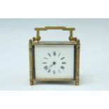 An early 20th Century brass carriage clock, keyless wind, key set, the case having turned corner