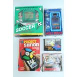 Sundry vintage hand-held electronic games / video games, including Pocket Simon, a Casio MG-200 "