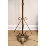An Edwardian brass telescopic brass oil lamp stand, later converted to electricity, having a