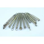 13 fob propelling pencils, including one silver and one white metal (tests as silver)