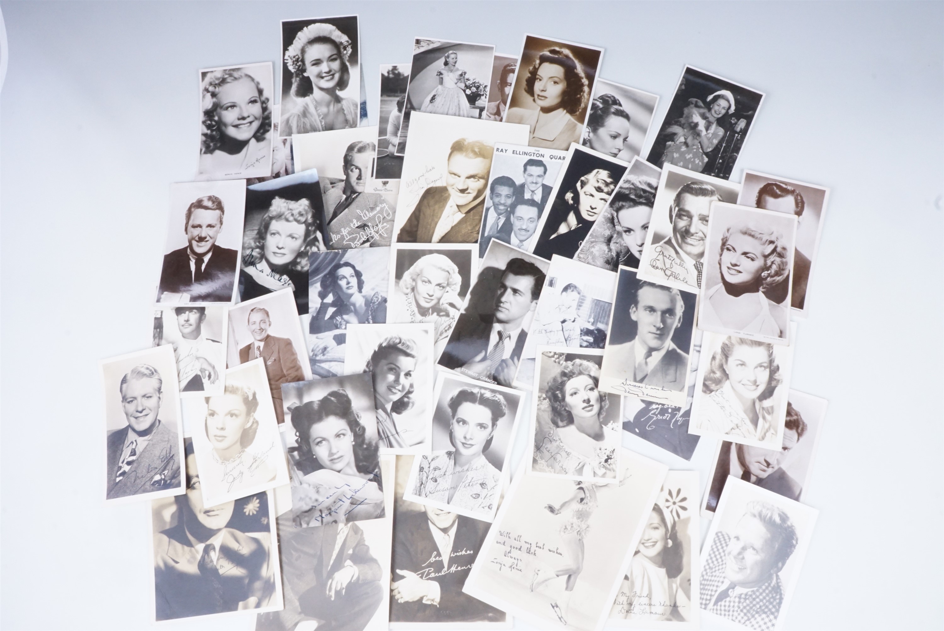 A quantity of promotional portrait photographs and postcards of screen and stage stars, circa