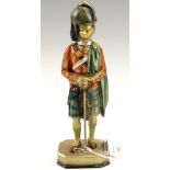 A 1930s Austrian cold painted spelter table / cigar lighter, formed as a Scots guardsman, 24 cm