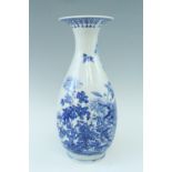 A contemporary blue-and-white baluster vase with everted rim, decorated in depiction of birds flying