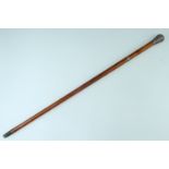 [ Cricket ] An Edwardian Anglo-Indian malacca cane, having a foliate-scroll-chased pommel