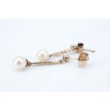 A pair of pearl and 9 ct gold ear pendants, each having a pearl suspended from a baton, dependent on