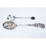 An enamelled silver coffee spoon, having a bean terminal and its bowl enamelled in depiction of