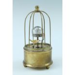 A late 20th Century brass automaton alarm clock, the keyless movement having an orbital dial with