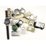 A group of vintage lighters incorporating a watch face / timepiece, including Aircraft, Diplomat,