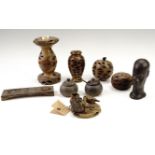 A small group of turned Banksia and similar nut items, including a candlestick, together with an