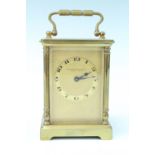 A mid 20th Century brass carriage clock, keyless wind movement, the case having turned corner