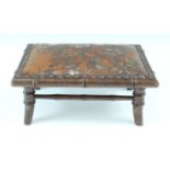A late 19th / early 20th Century Japonisme small leather-upholstered faux bamboo stool, its hide