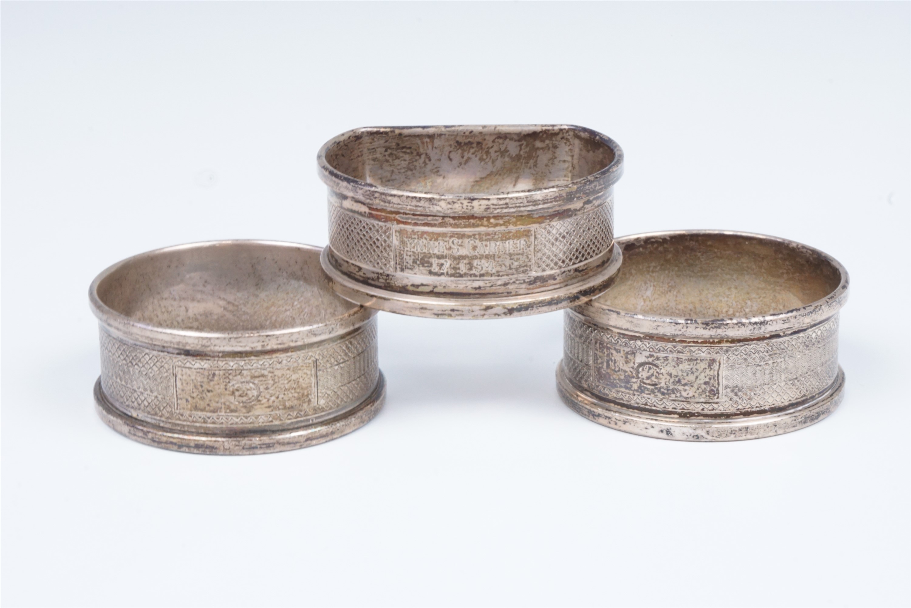 A pair of mid 20th Century silver napkin rings and one other, 41 g