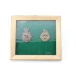 Framed 34th and 55th Regiments of Foot badges