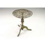 A Victorian cast brass tripod trivet, having a circular top pierced with a Greek key border, 23.5 cm