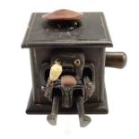 An early 20th Century Japanese Kobe mechanical humourous toy, 7 x 7 x 6 cm