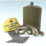 A set of Second World War British army goggles, a water bottle, burnishing mail and Civil Defence