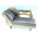 A Victorian miniature or doll's chaise longue, in faux-leather upholstered and carved pine, 59 cm