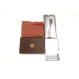 A group of vintage combination cigarette case and lighters, comprising a boxed Windsor example, a