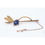 A late 19th / early 20th Century 9 ct yellow metal dragonfly brooch, set with a large facet-cut oval