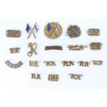 A small group of British and Canadian army metal shoulder titles and qualification badges
