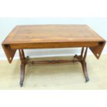 A modern yew veneered coffee table in the manner of a sofa table, 119 cm x 42 cm x 49 cm