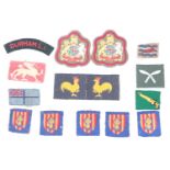 A small group of Second World War British army cloth insignia including 40th Infantry division