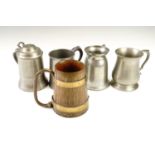 Three pewter tankards together with a coopered oak tankard having copper hoops
