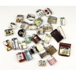 A group of vintage enamelled and similar gas lighters, including Ronson, Omega, Monami etc