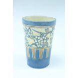 A Victorian Brannam, Barum pottery beaker, polychrome decorated in an Aesthetic Movement