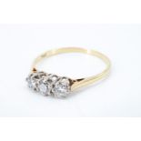 A three stone diamond and 18 ct gold ring, having three brilliant diamonds, of approximately .3 ct