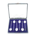 A cased set of 1920s silver coffee spoons, having bean shaped terminals