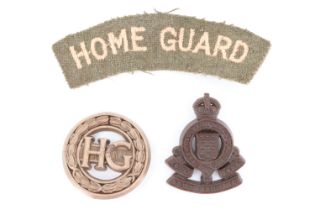 A Home Guard women's auxiliaries plastic badge, together with a shoulder titles and an RAOC