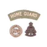 A Home Guard women's auxiliaries plastic badge, together with a shoulder titles and an RAOC