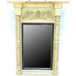 A Regency gilt framed pier mirror, having turned supports, moulded entablature, and ebonised slip,