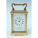 A late 20th Century brass carriage clock, key wind and set, the case having fluted square corners