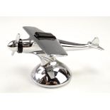 A 1950s novelty petrol table lighter in the form of a high wing propeller aircraft, 15 cm long