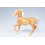 A Beswick palomino horse, 18 cm