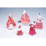 Four Royal Doulton figurines, comprising Top o' The Hill, Genevieve, Christmas Morn, and Vanity (a/