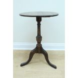 An early 19th Century oak tripod wine table, 49 cm x 76 cm