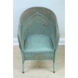 A 1939 Lloyd Loom armchair in its original parcel-gilt green finish