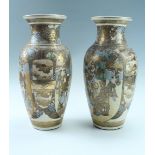 A pair of late Meiji Japanese Satsuma earthenware vases, each of elongated ovoid form with a wide