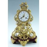 A 19th Century French gilt metal mantle clock, having a drum movement with a pendulum escapement