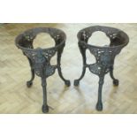 A pair of antique cast iron bar table bases