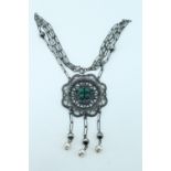 A 20th Century Hungarian silver necklace, comprising a pierced and embossed rosette bearing four