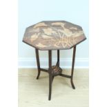 An early 20th Century Arts and Crafts influenced mahogany folding occasional table, poker-worked