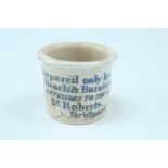 An Victorian transfer-printed earthenware ointment pot, emblazoned "Prepared only by Beach &