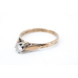 A diamond solitaire ring, having a brilliant diamond of approximately .15 ct, basket set between
