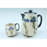 A William Moorcroft attributed MacIntyre "Forget Me Not" pattern hot water jug and milk jug, circa