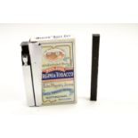 A vintage "Pack-Mate" cigarette lighter together with an Art Deco evening bag wheel lighter